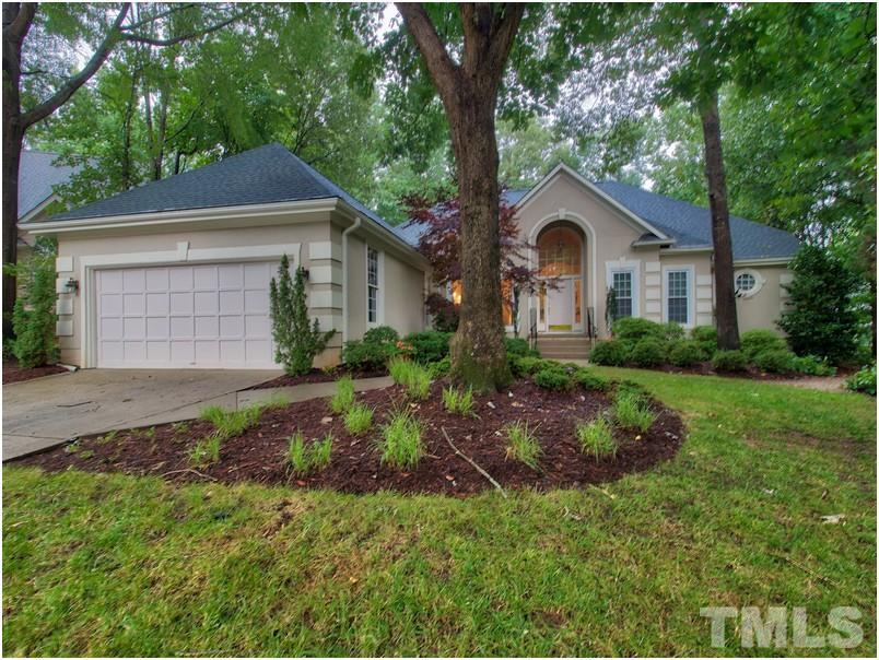 Beautiful real stucco ranch with two car garage on private cul-de-sac lot with extensive landscaping.