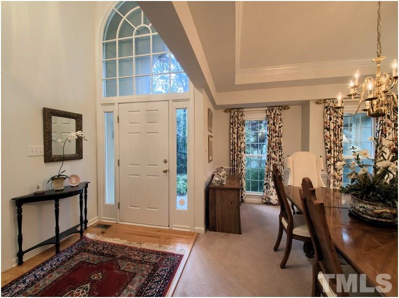 Grand entry foyer with soaring ceiling and beautiful hardwood floor.