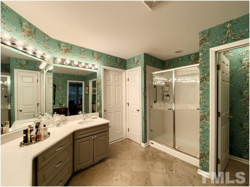 8501 Bluebill Court Raleigh, NC 27615 - Photo 16 of 25 Master suite has large walk in closet and walk in shower.