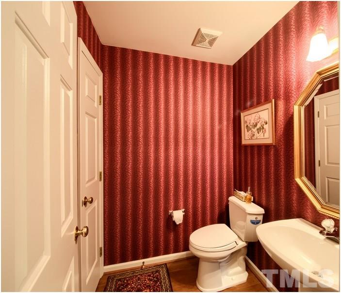 8501 Bluebill Court Raleigh, NC 27615 - Photo 22 of 25 Nice half bath has pergo floor.