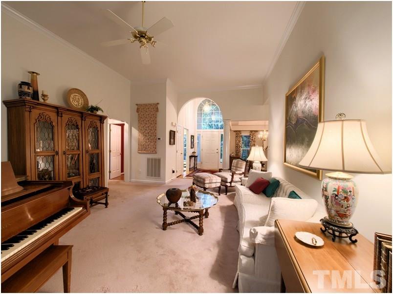 Enviting living room with easy access to foyer, dining room, kitchen, office and master suite.