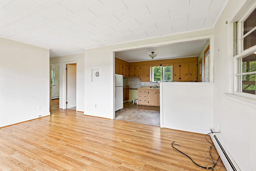 2525 West River Road Sidney, ME 04330 - Photo 15 of 41 Half wall separates spaces