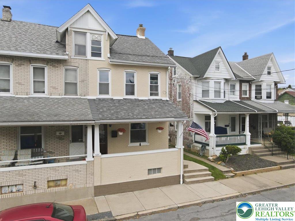 This charming residence presents a classic facade with inviting curb appeal.