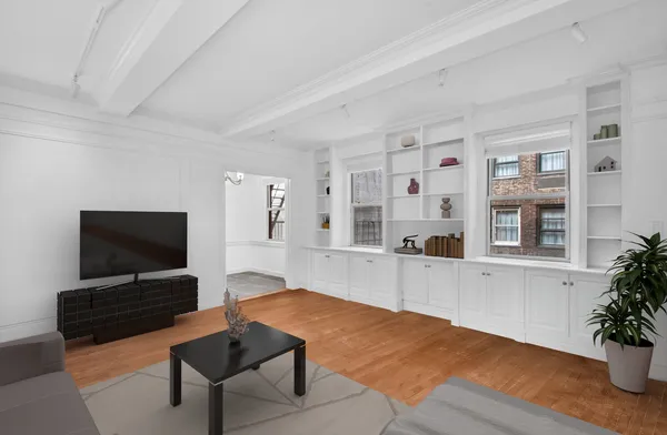 a dining room with furniture and wooden floor