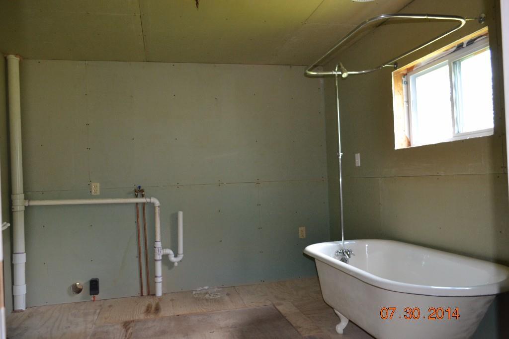 462 Snakeroot Road Pittsfield, ME 04967 - Photo 9 of 16 Full bathroom with laundry hook-up.