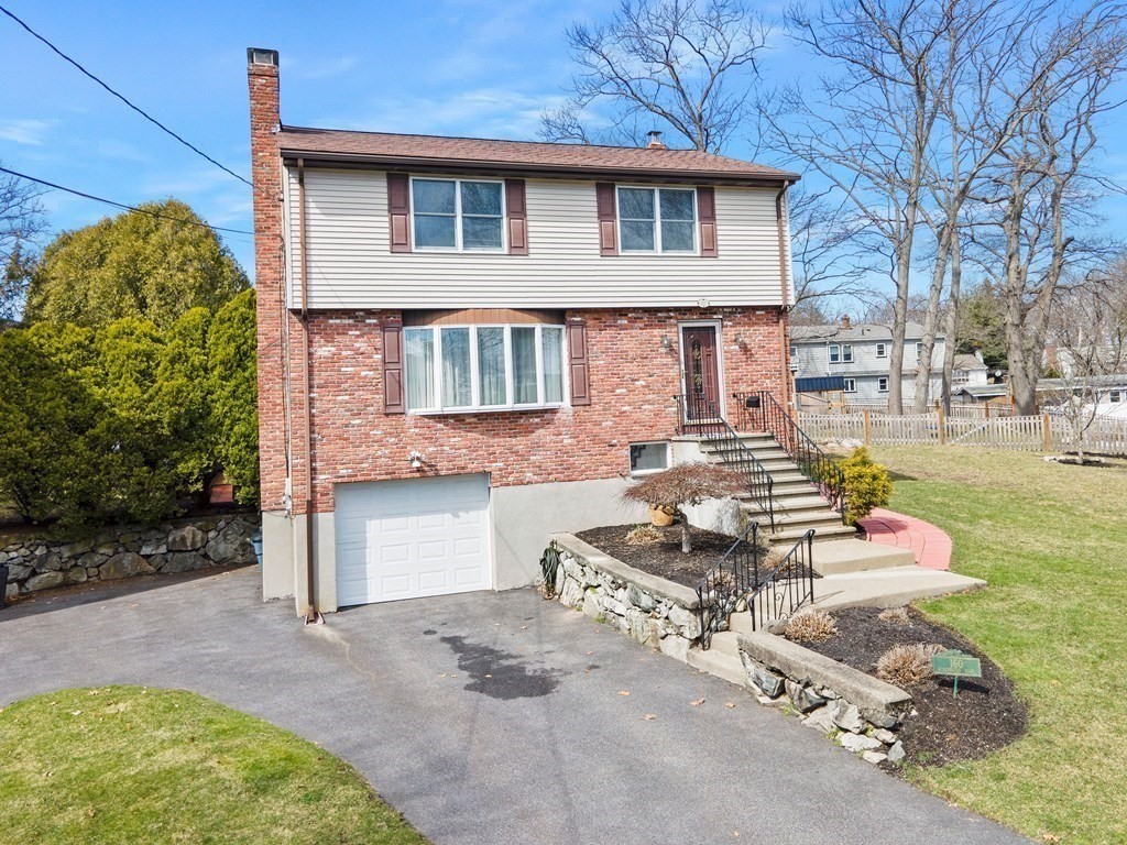 160 Winchester Road Arlington, MA 02474 - Photo 1 of 33 a front view of a house with garden