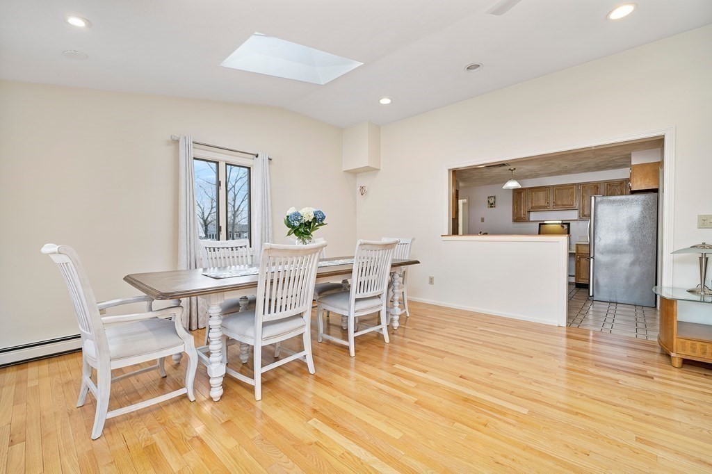 160 Winchester Road Arlington, MA 02474 - Photo 15 of 33 a view of a dining room with furniture and wooden floor