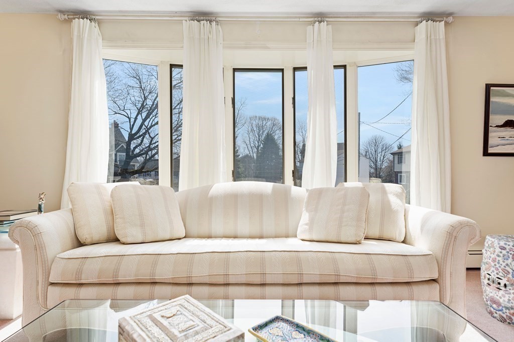 160 Winchester Road Arlington, MA 02474 - Photo 5 of 33 a living room with furniture and a large window