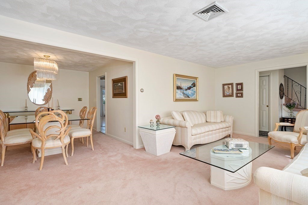 160 Winchester Road Arlington, MA 02474 - Photo 8 of 33 a living room with furniture and a wooden floor