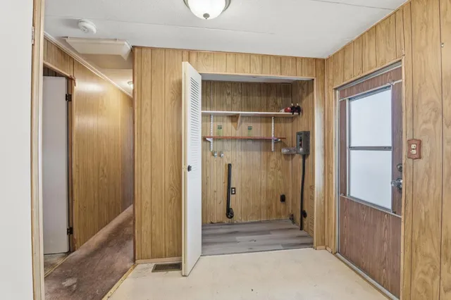 a view of a pathway with a flower garden