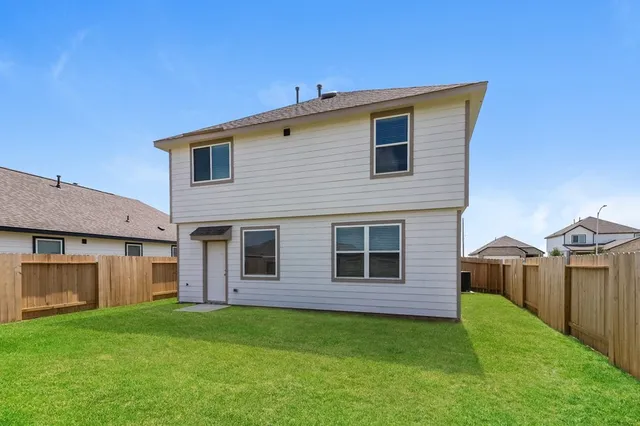 a view of a back yard of the house