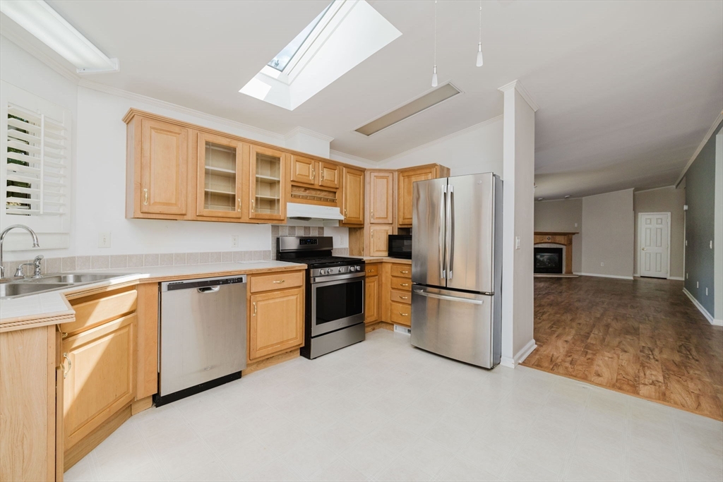 2602 Green Street Middleboro, MA 02346 - Photo 11 of 26 a kitchen with a refrigerator stove and sink