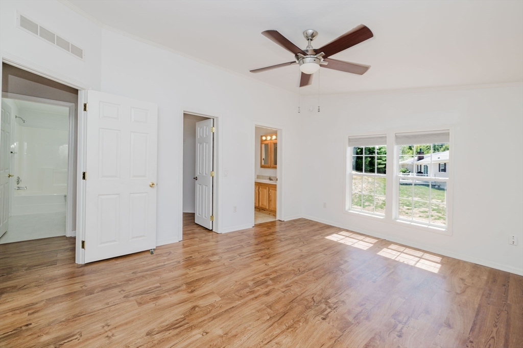 2602 Green Street Middleboro, MA 02346 - Photo 13 of 26 a view of a livingroom with a hardwood floor and a ceiling fan