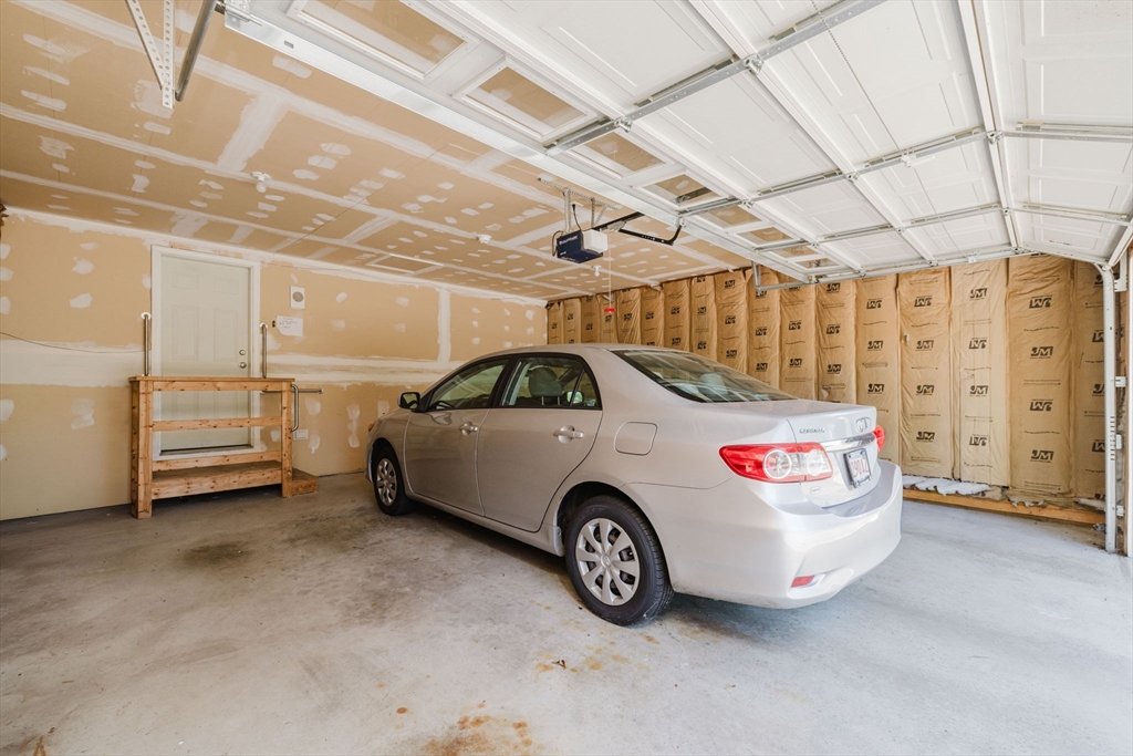 2602 Green Street Middleboro, MA 02346 - Photo 20 of 26 a car parked in a garage