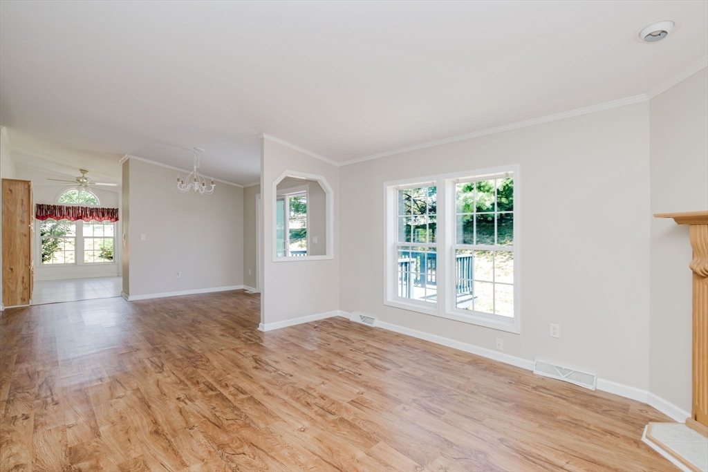 2602 Green Street Middleboro, MA 02346 - Photo 9 of 26 an empty room with wooden floor and windows