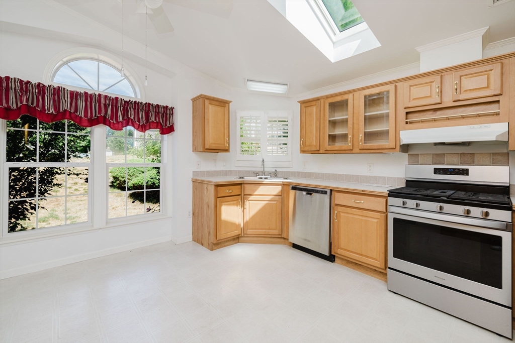 2602 Green Street Middleboro, MA 02346 - Photo 10 of 26 a kitchen with stainless steel appliances granite countertop a stove a sink and a microwave