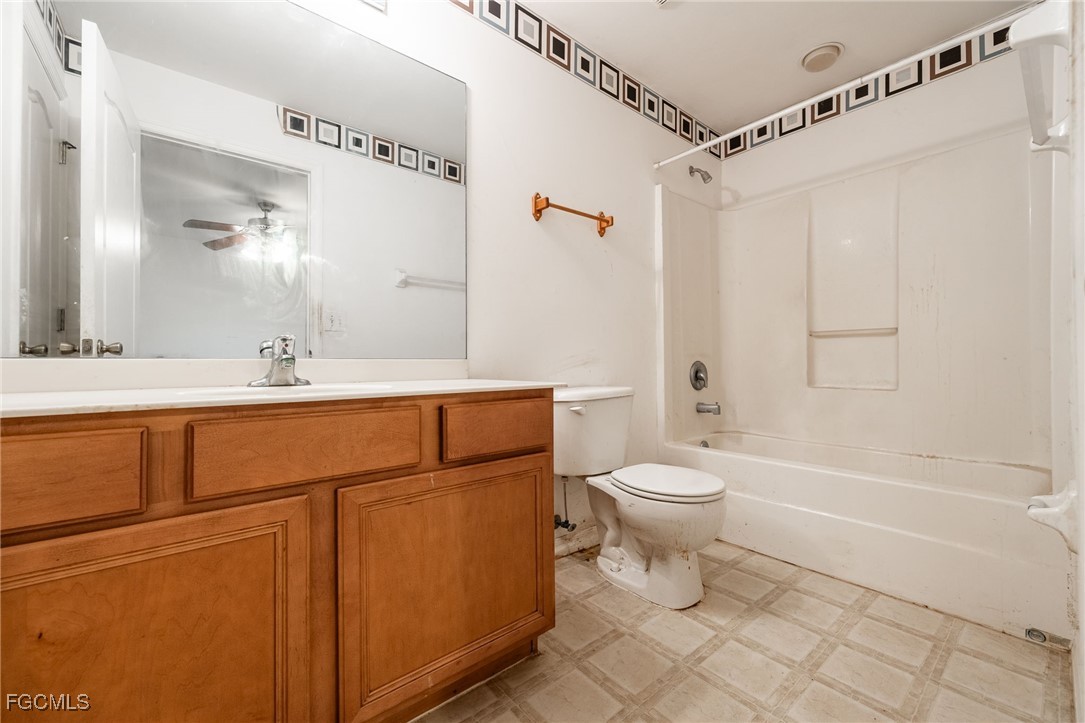 2406 East 23rd Street Alva, FL 33920 - Photo 19 of 33 a bathroom with a sink a toilet and shower