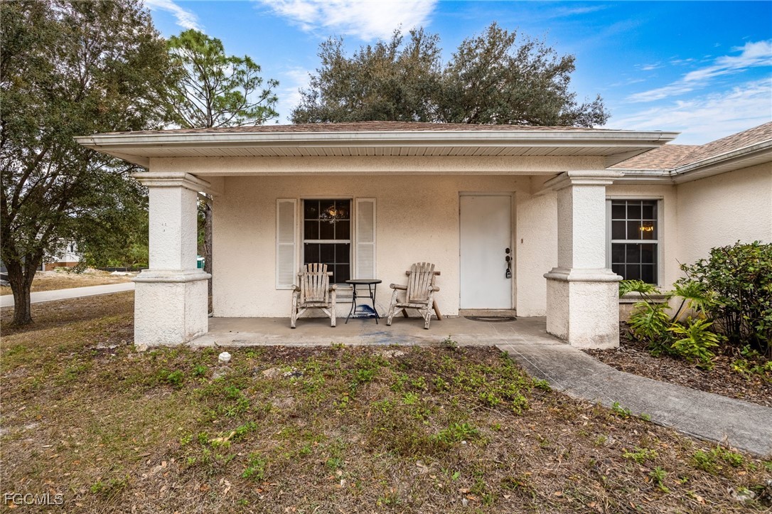 2406 East 23rd Street Alva, FL 33920 - Photo 3 of 33 a front view of a house with patio