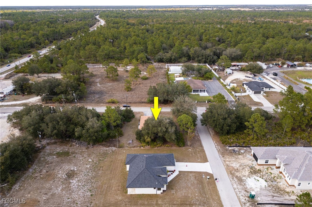 2406 East 23rd Street Alva, FL 33920 - Photo 32 of 33 an aerial view of multiple houses with yard