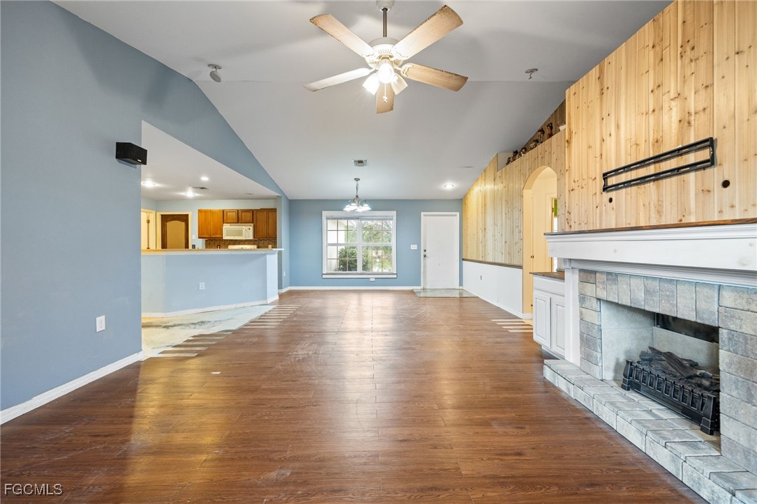 2406 East 23rd Street Alva, FL 33920 - Photo 10 of 33 a view of an empty room with window and wooden floor