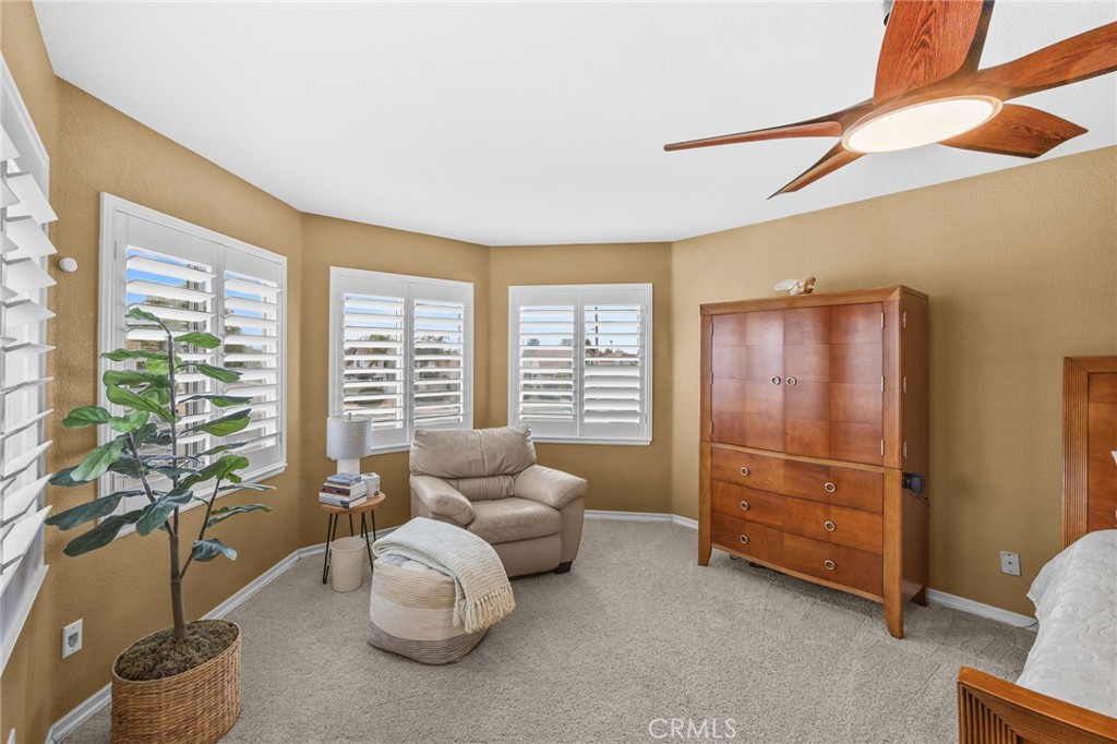 20257 Edmund Road Riverside, CA 92508 - Photo 28 of 53 a bedroom with furniture and a large window