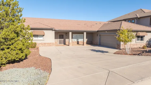a view of a livingroom with furniture window and wooden floor
