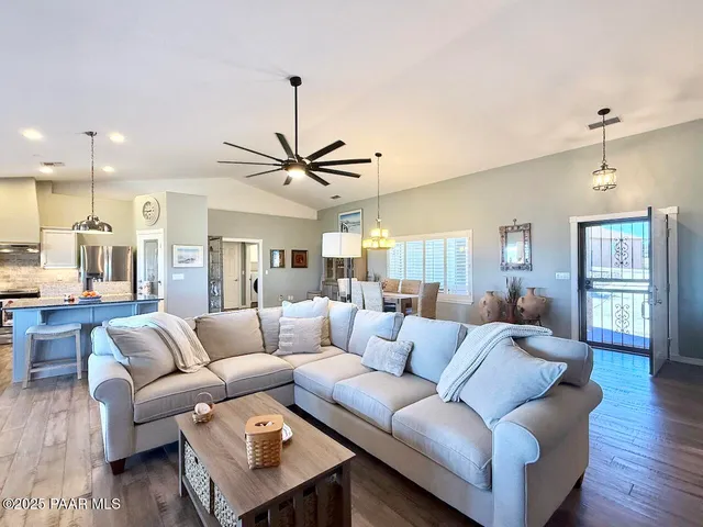 a kitchen with granite countertop a sink appliances and cabinets