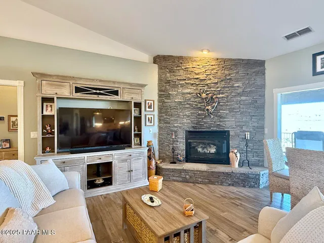 a kitchen with a stove top oven and refrigerator