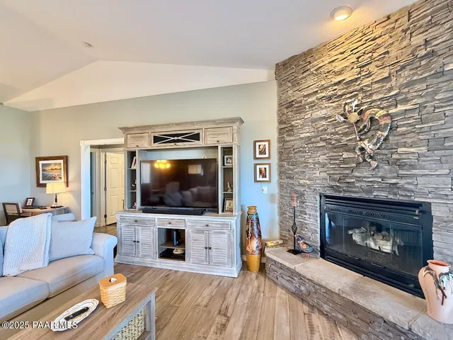 a kitchen with granite countertop a sink cabinets and stainless steel appliances