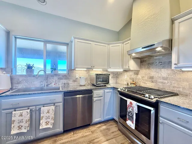 a view of walk in closet with clothes
