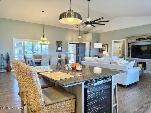 a bedroom with two beds and a chandelier