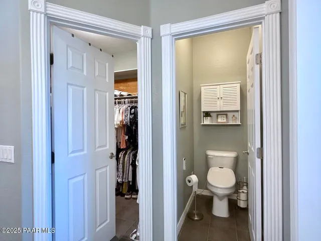 a view of a porch with furniture and garden