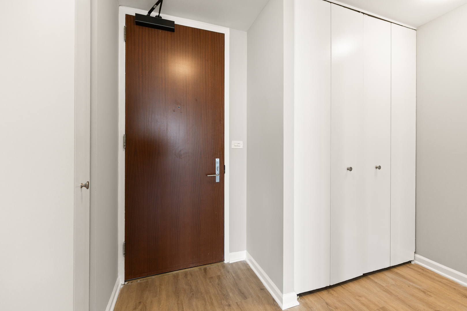 655 West Irving Park Road, Unit 5306 Chicago, IL 60613 - Photo 14 of 28 a view of a hallway with wooden floor