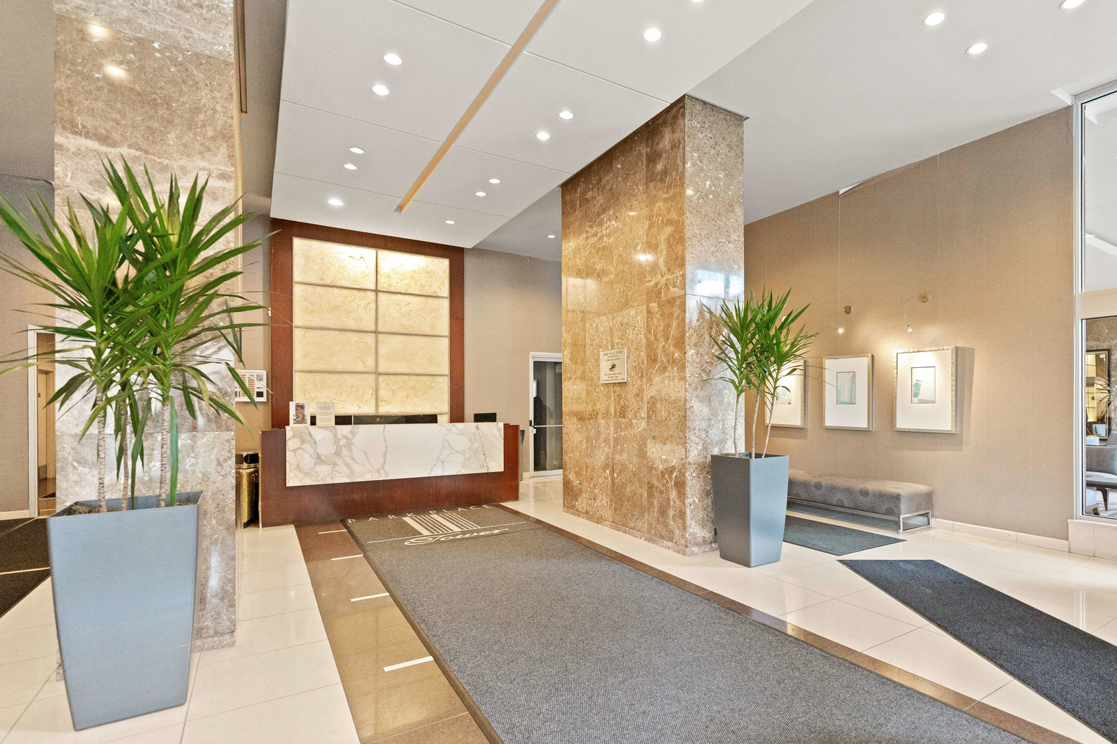655 West Irving Park Road, Unit 5306 Chicago, IL 60613 - Photo 21 of 28 a lobby with furniture and a potted plant