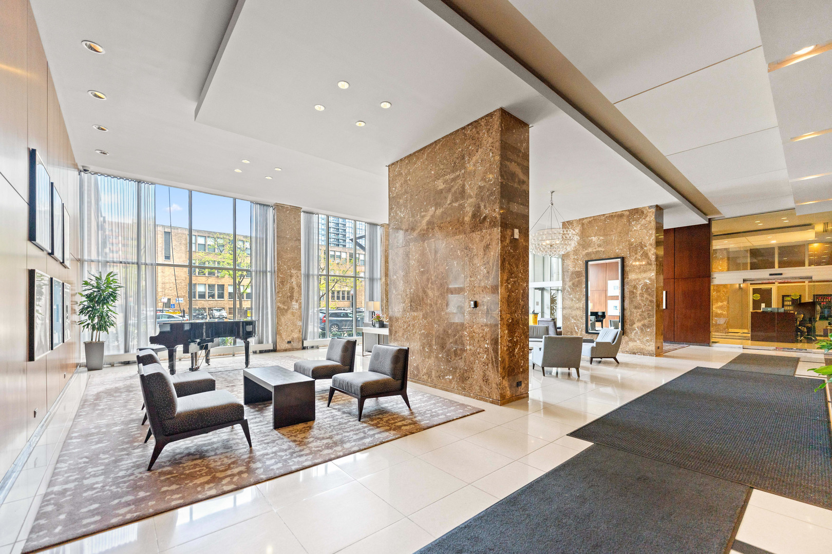 655 West Irving Park Road, Unit 5306 Chicago, IL 60613 - Photo 23 of 28 a living room with furniture and large windows