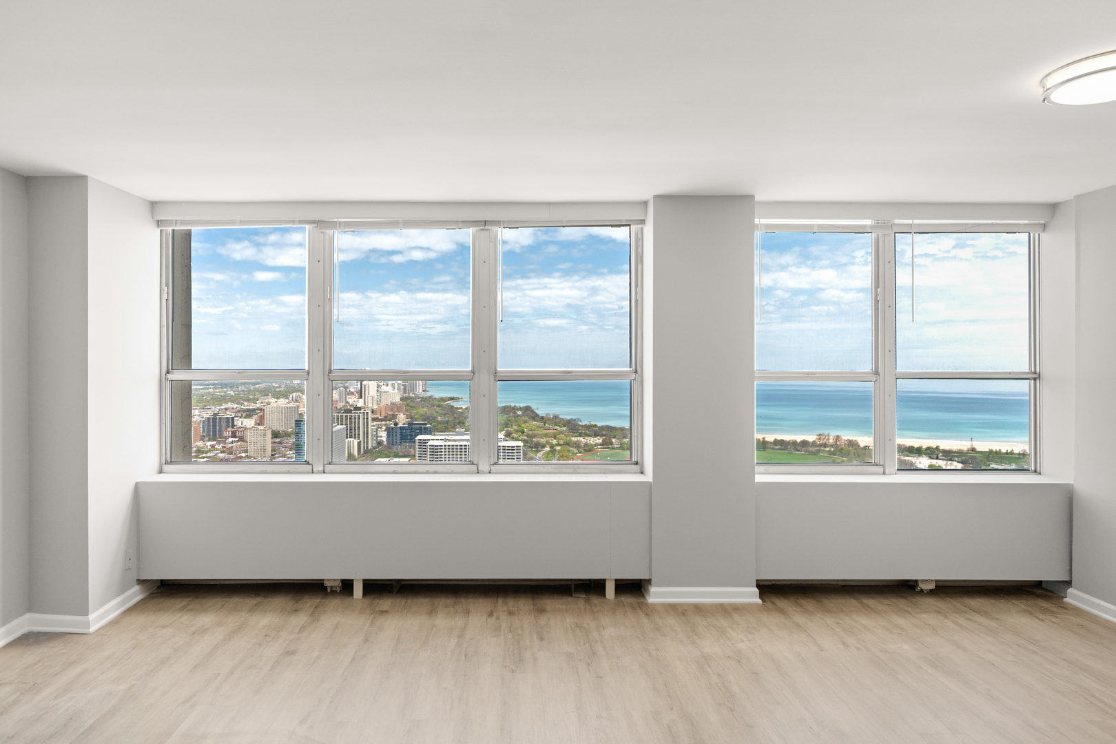 655 West Irving Park Road, Unit 5306 Chicago, IL 60613 - Photo 5 of 28 a living room with furniture and a large window
