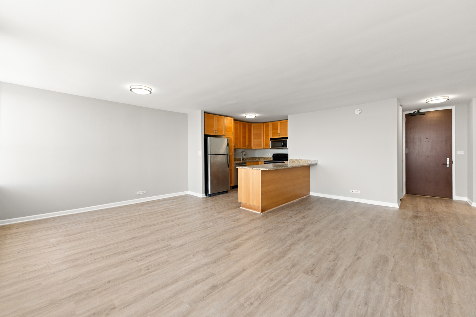 655 West Irving Park Road, Unit 5306 Chicago, IL 60613 - Photo 9 of 28 a view of kitchen with wooden floor