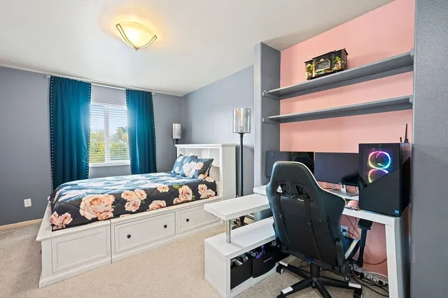 a bedroom with bed and a window