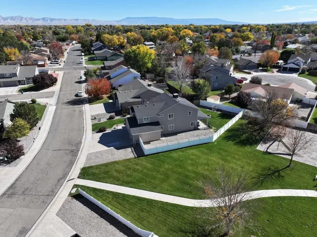 an aerial view of residential houses with outdoor space
