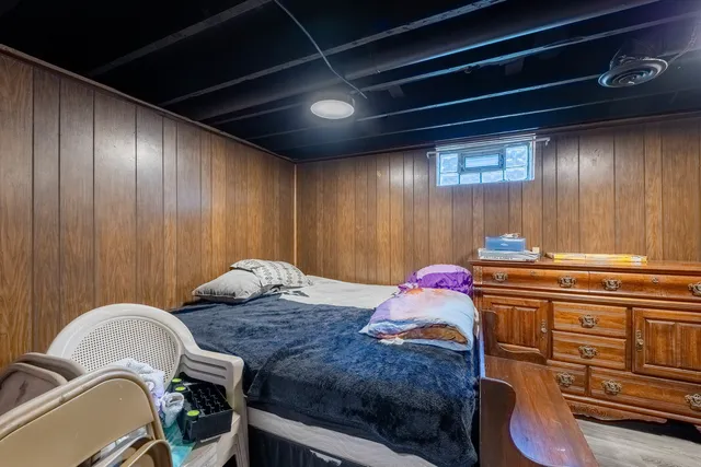 a bedroom with a bed and a dresser