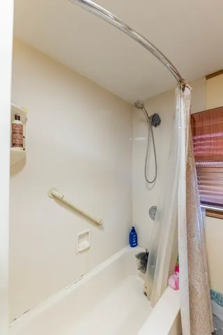 a bathroom with a sink a bath tub and a shower
