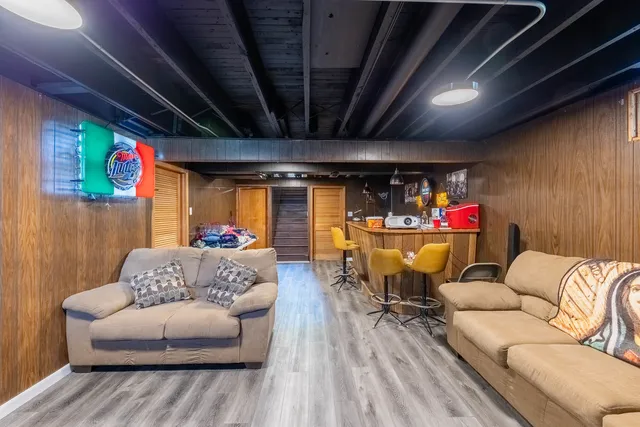 a outdoor living space with furniture and a fireplace