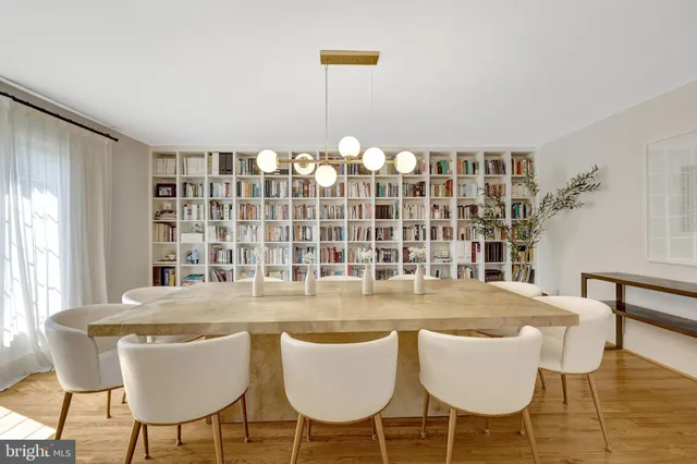 a living room with furniture tv and large window