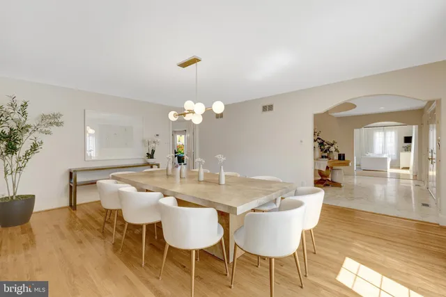 a very nice looking dining room with a large window