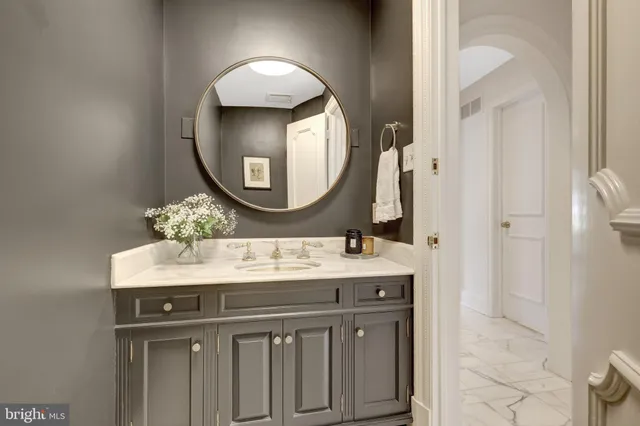 a large kitchen with kitchen island a sink a counter top space and appliances