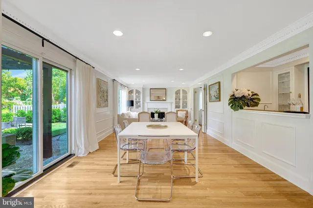 a kitchen with a sink a window and cabinets