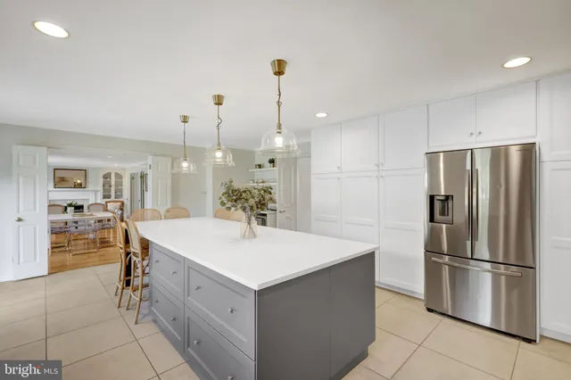 a spacious bedroom with two beds and a window