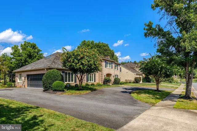 a view of living room filled with furniture and a chandelier