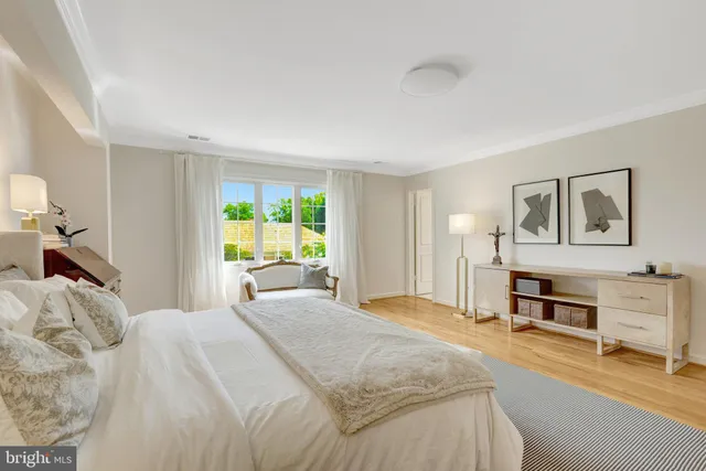 a spacious bedroom with a bed and a couch