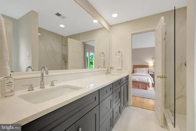 a front view of a house with swimming pool garden and patio